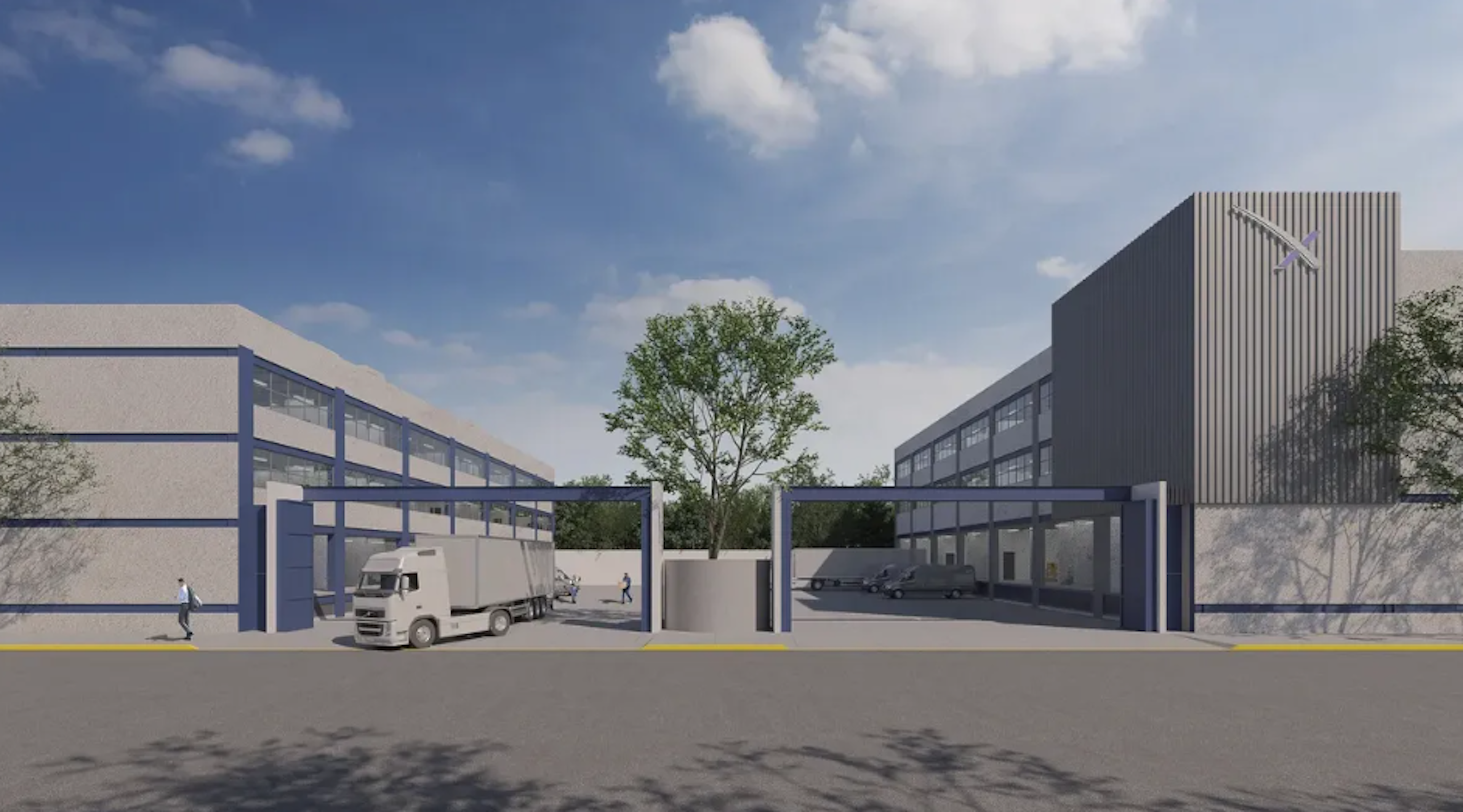 La imagen muestra un complejo industrial moderno con dos edificios principales de diseño contemporáneo. Hay una entrada con puertas azules para camiones y vehículos. Se observa un camión de carga entrando y algunos vehículos más pequeños en el interior. El complejo tiene una estética limpia con tonos grises y azules, y árboles que añaden un toque de verde. El cielo es azul con algunas nubes, dando una sensación de un día despejado.